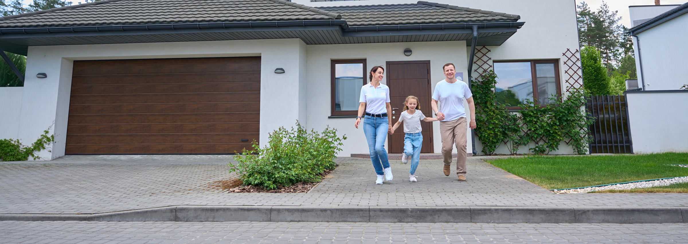 Australian family walking outside their home, representing household energy and gas bill savings
