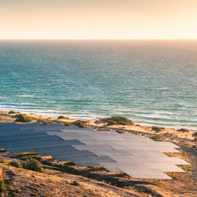 Illustration of Queensland's energy transition showing coal plants renewables solar battery storage and transmission lines
