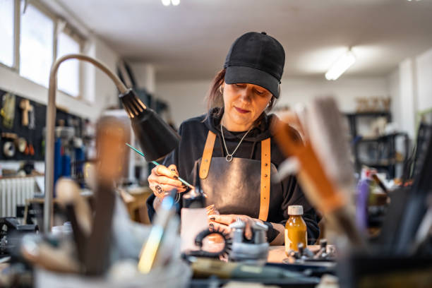 Self-employed business owner working in a workshop, representing home loan refinance options in Australia
