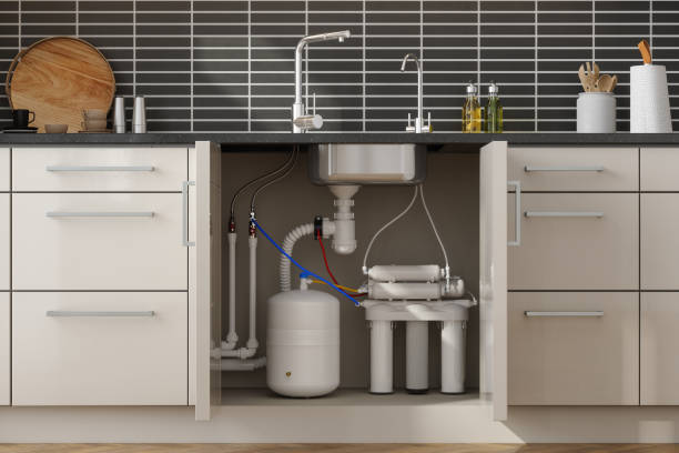 Whole home water filtration system installed under a kitchen sink