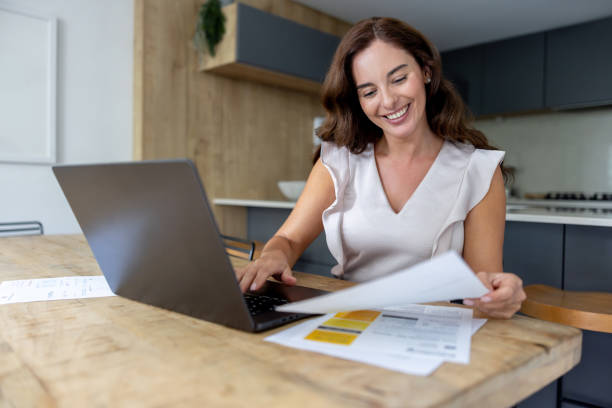 Australian woman reviewing her electricity bill online to understand energy charges